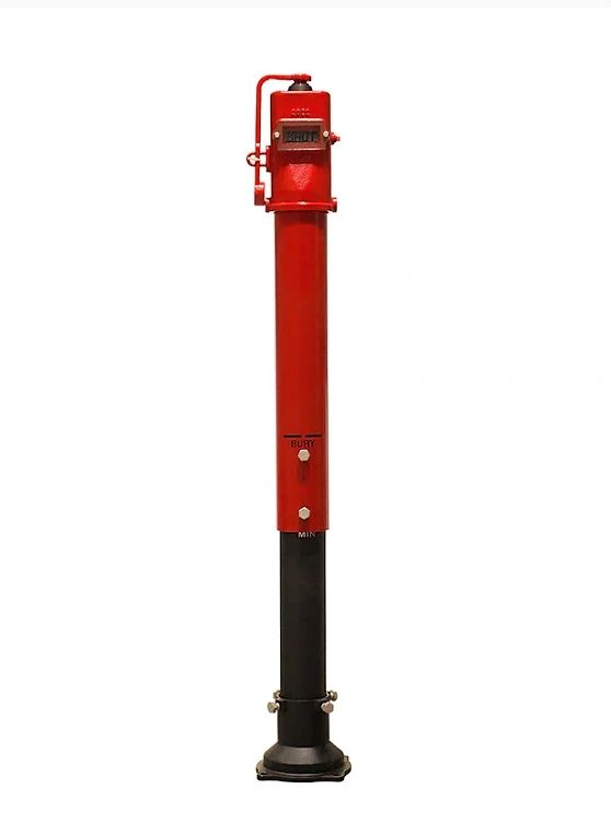 A vintage Vertical Indicator Post with a tall cylindrical design, featuring a dial and nozzle at the top.