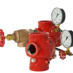 Two red Riser Grooved Swing Check Valves with pressure gauges attached, featuring a brass component and a red handle on the left.