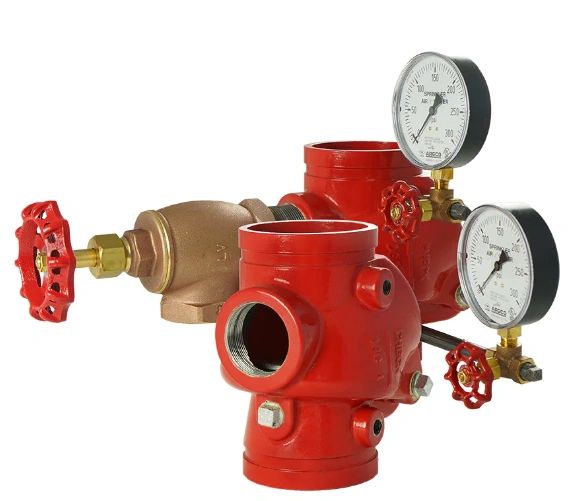 Two red Riser Grooved Swing Check Valves with pressure gauges attached, featuring a brass component and a red handle on the left.