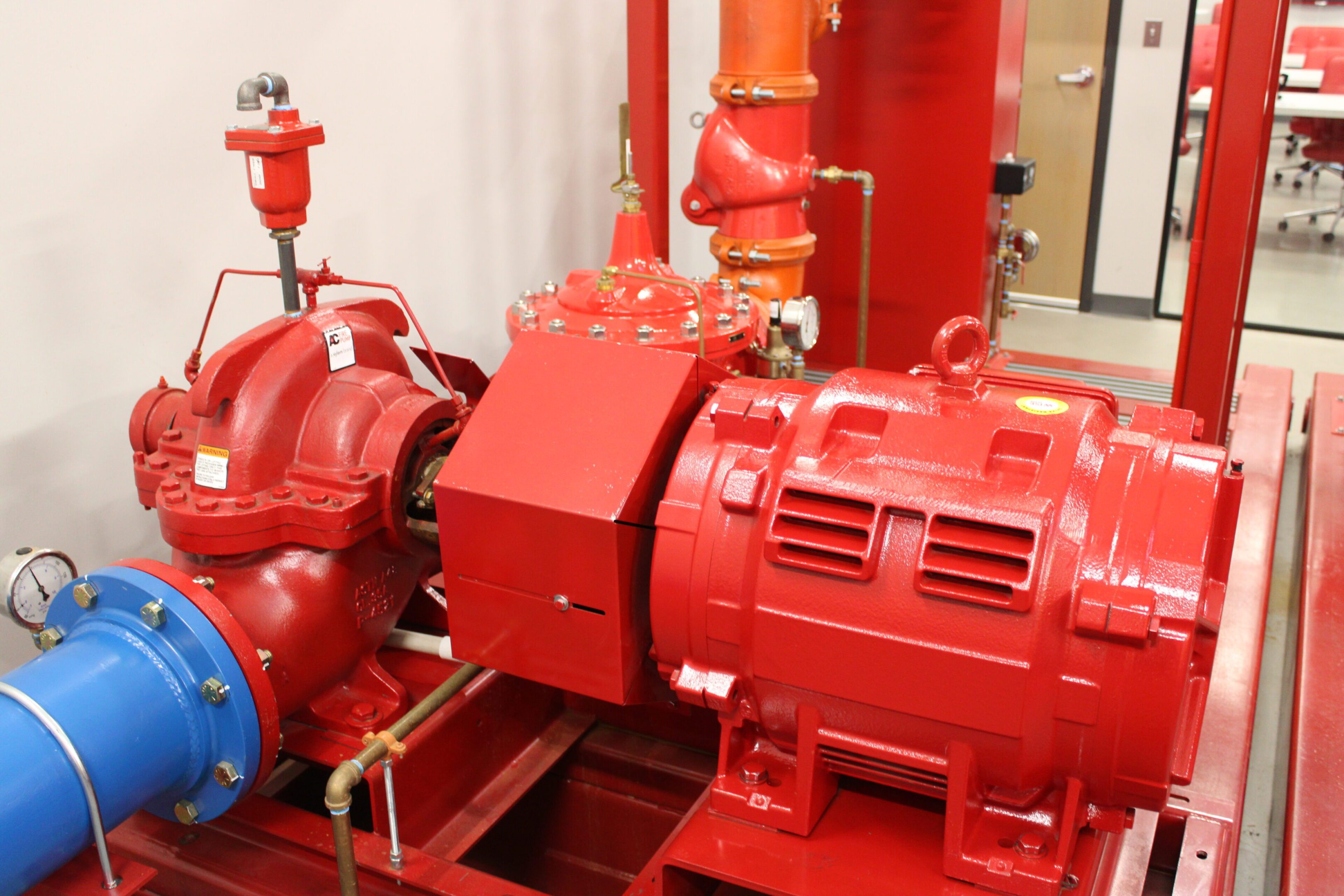 IMG_4561 A red fire hydrant with a pump and valves.
