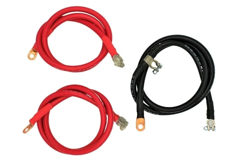A pair of red and black cables are connected to each other.